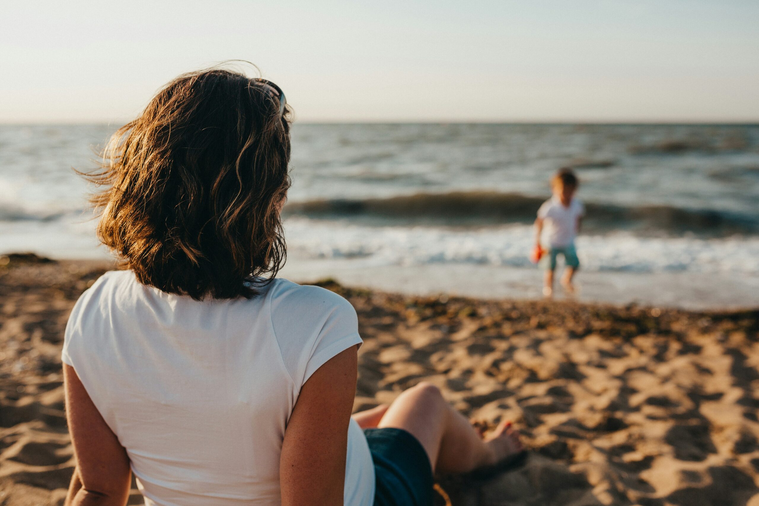 Relaxing at a San Diego beach, representing the peace of mind families experience with Next Wave Cleaning Services